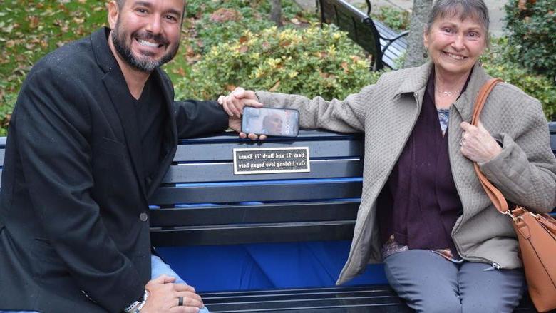 Barb Evans and her son Brett and a bench dedication